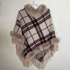 Plaid poncho lined in fur and fringe